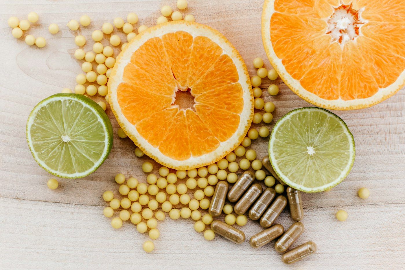 Capsules and softgels arranged on a wooden surface